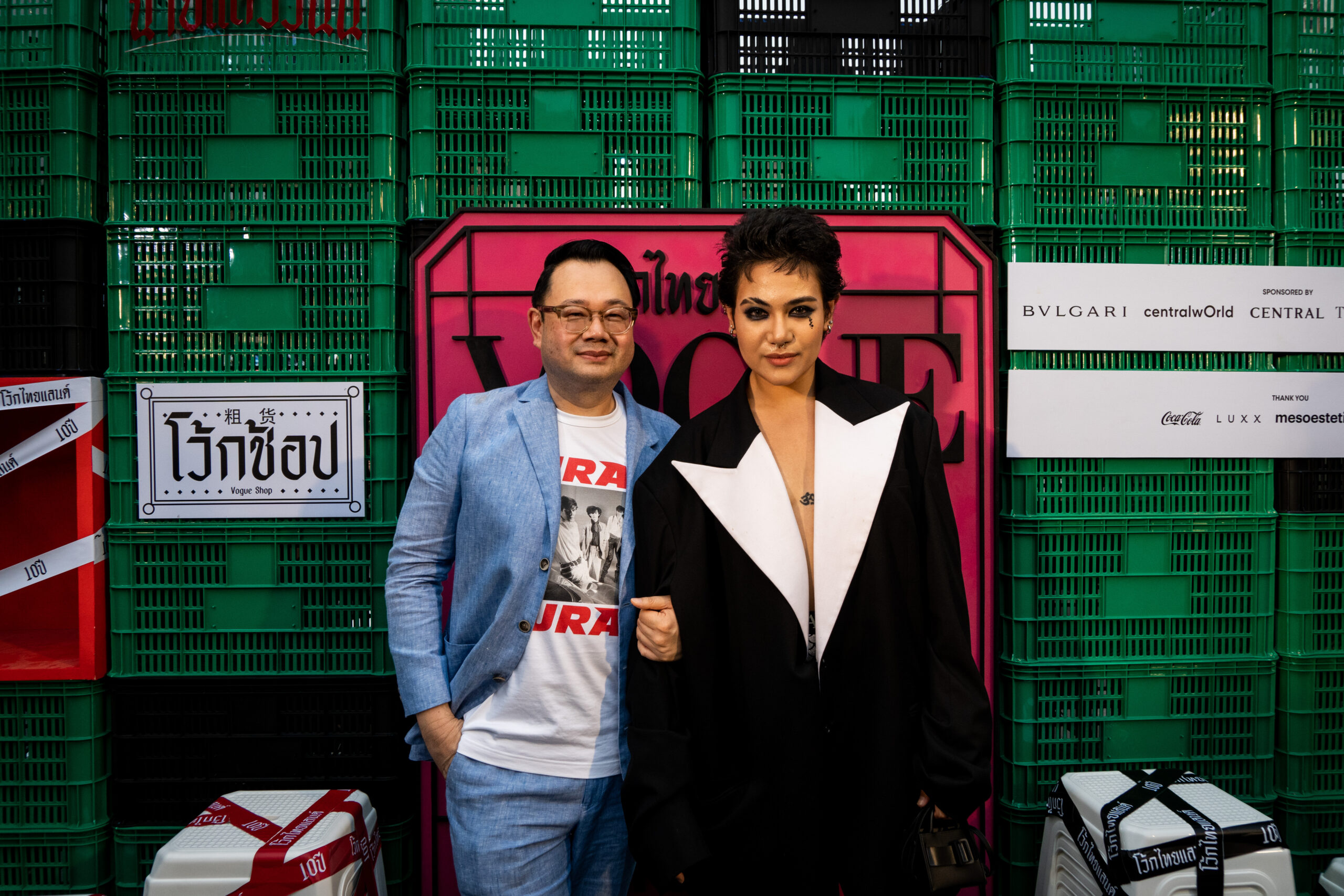 Kullawit 'Ford' Laosuksri, Editor-in-Chief of VOGUE Thailand (L) and SILVY (R) pose for a photo before the runway show. VOGUE celebrates the 10th anniversary of its magazine in Thailand with a fashion show spotlighting Thai designers at Central World Square in Bangkok, Thailand, on March 10, 2023.
